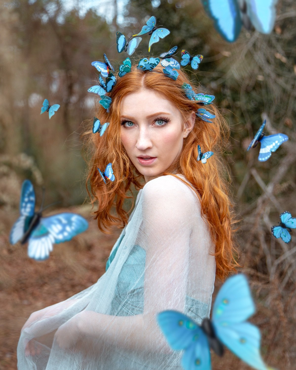 Melissa with blue butterfly crown, forest portrait