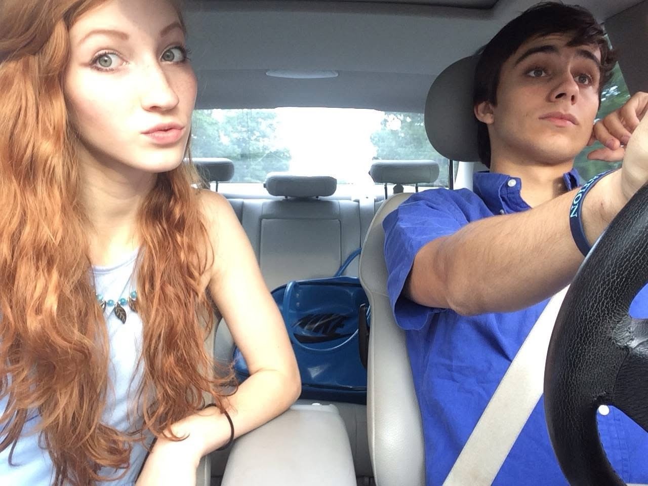 Passenger-seat selfie of Melissa with her boyfriend driving