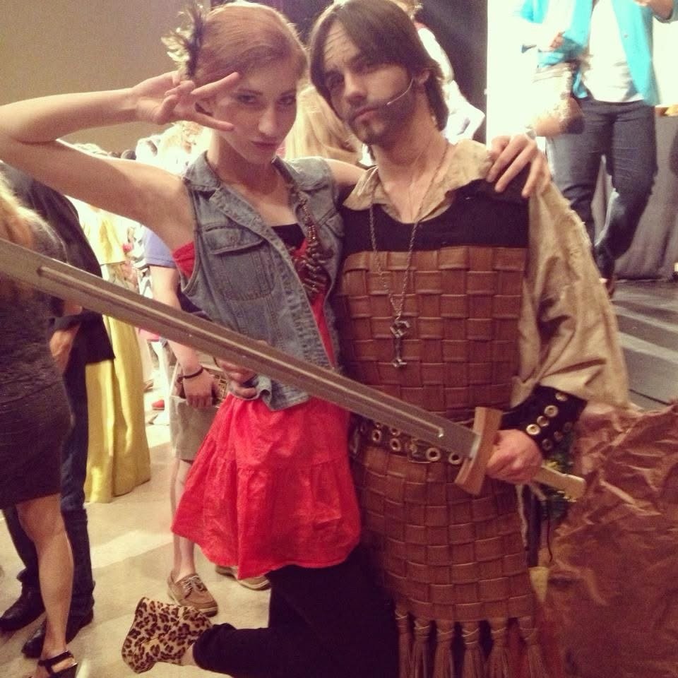 Backstage candid, Melissa in denim vest with boyfriend in theatre warrior costume