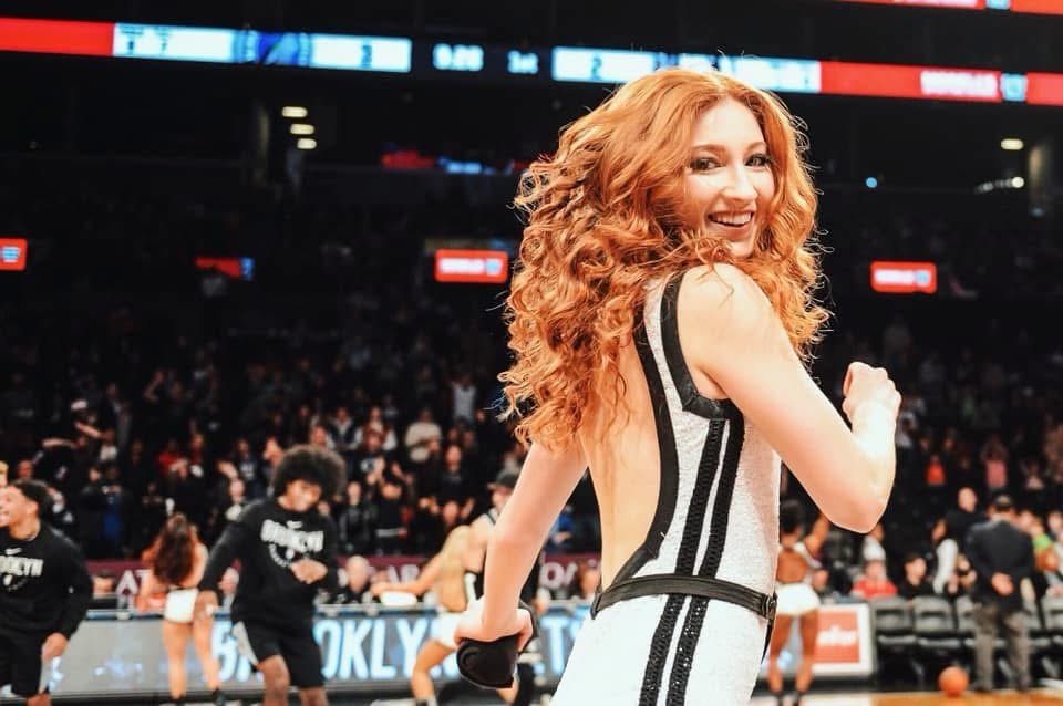 Glancing back over her shoulder on the basketball court